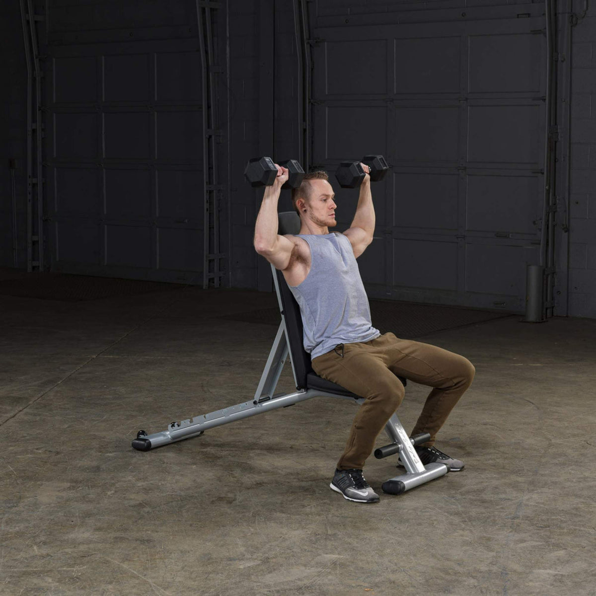 Body-Solid Commercial Folding Bench GFID225B Man performing seated dumbbell shoulder press on adjustable bench