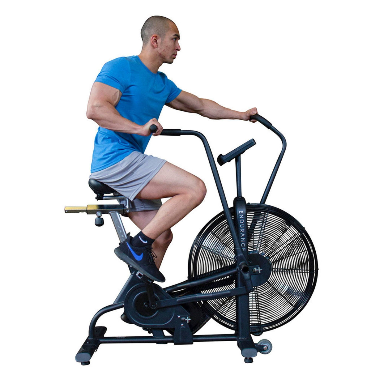 Body-Solid Endurance Dual Action Fan Bike FB300B Man using Body-Solid Endurance FB300 fan bike for full-body cardio workout