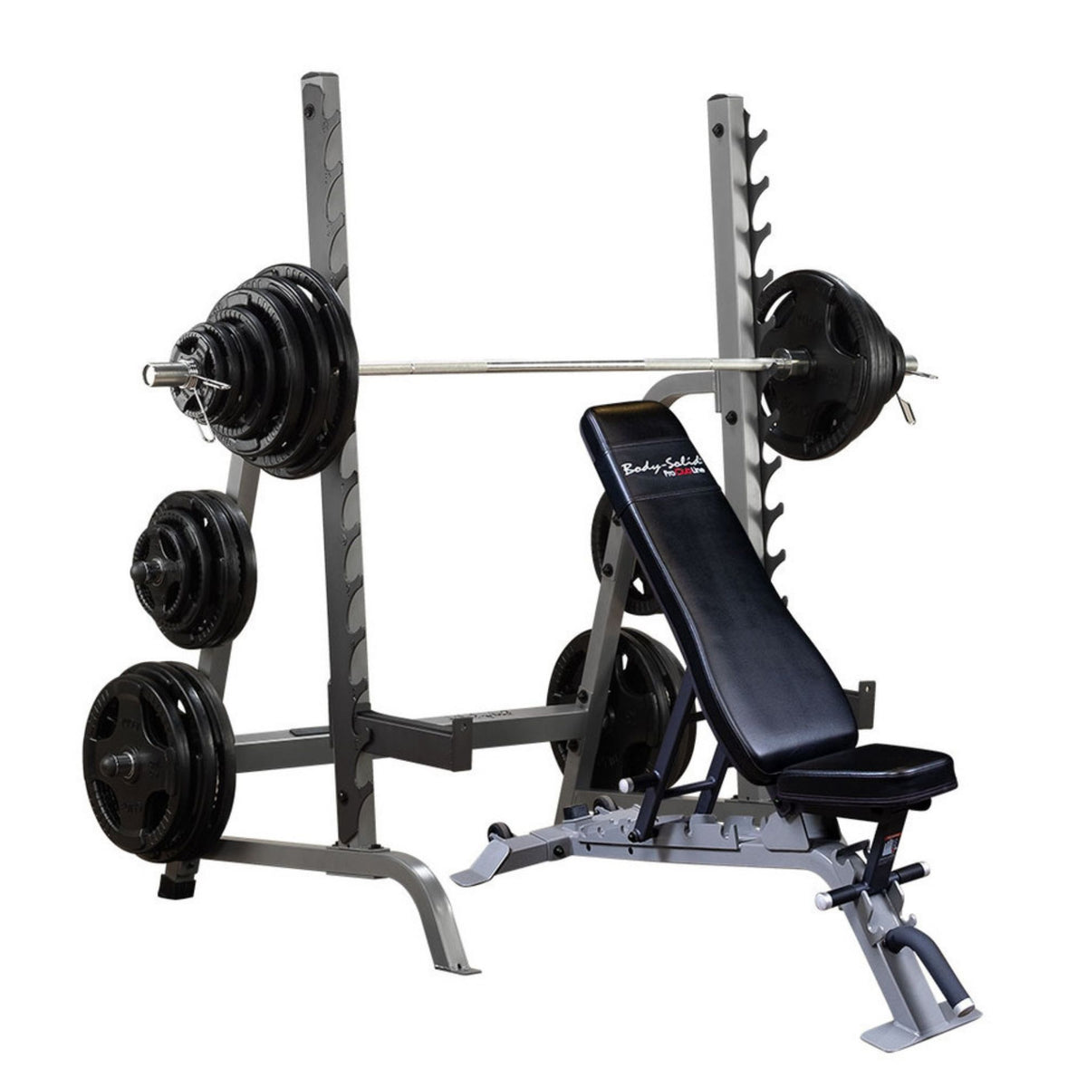 Body-Solid Olympic Squat Rack with Bench SDIB370 adjustable weight bench, loaded with black weight plates on a barbell