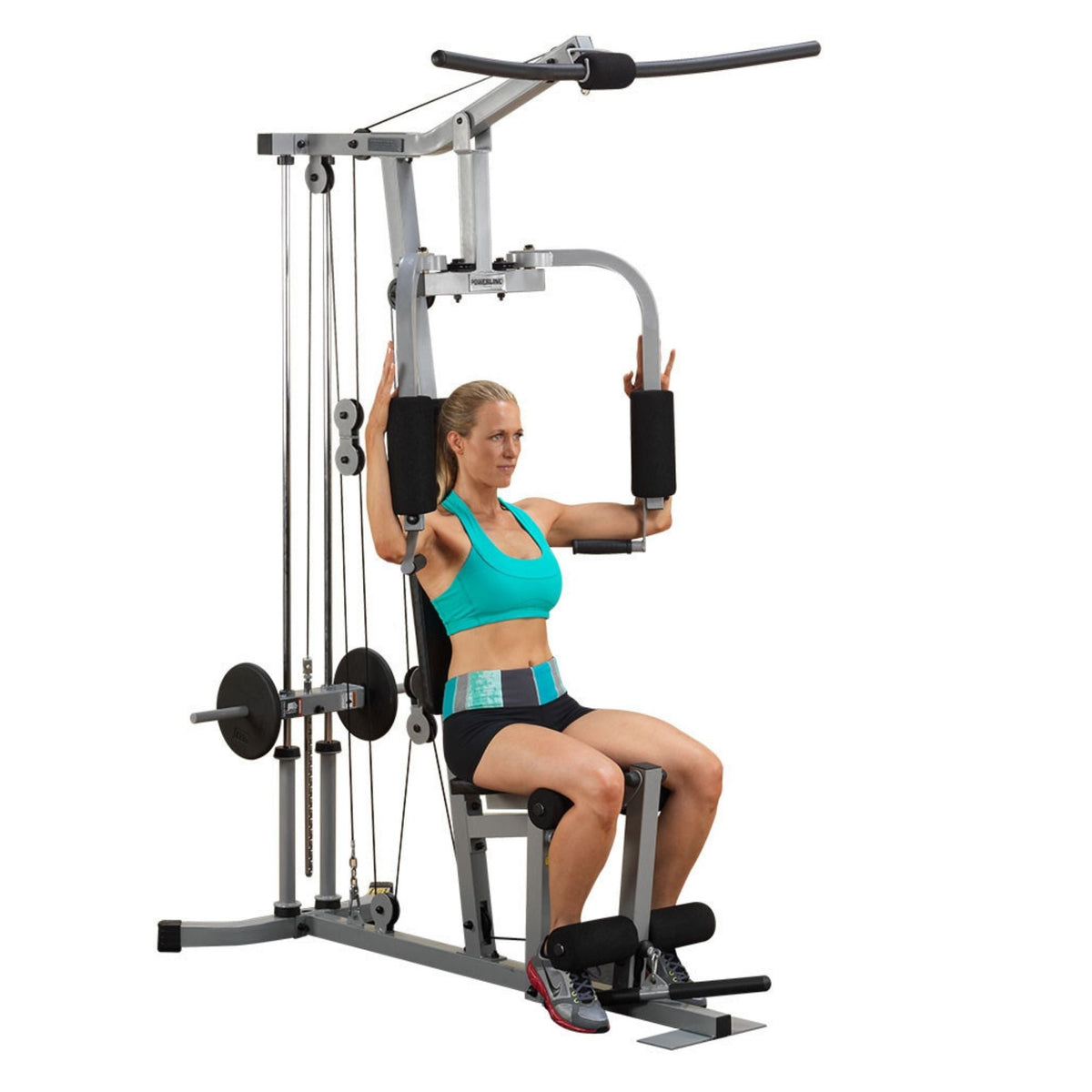 Body-Solid Powerline Plate Load Multi-Station Gym PHG1000X Woman performing chest fly exercise