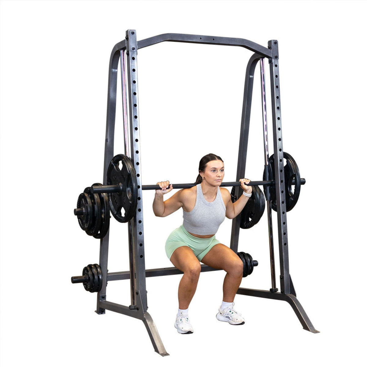 Body-Solid Powerline Smith Machine PSM200 Woman performing squats