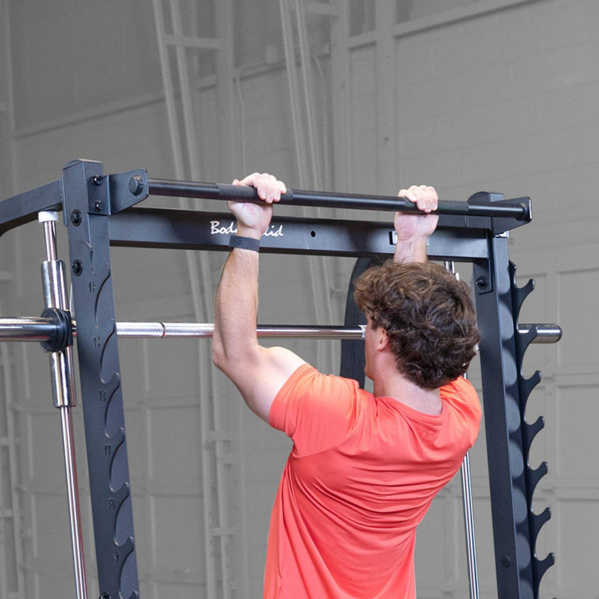 Body-Solid Smith Machine Pull Up Bar GPU348 with a user performing close view