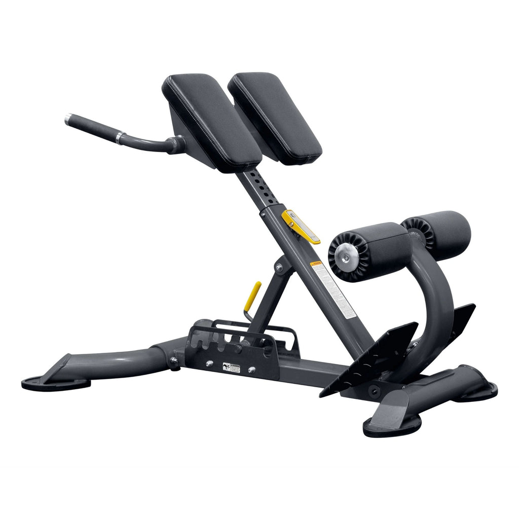 BodyKore Multi Hyper Extension CF2104 with padded support, foam leg rollers, and sturdy steel frame, designed for back and core strengthening exercises.