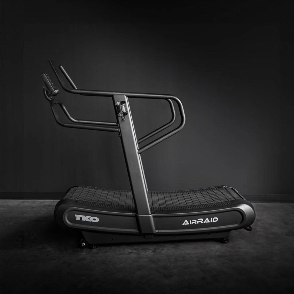 The TKO AirRaid Runner Manual Treadmill 8CTM in a home gym setting