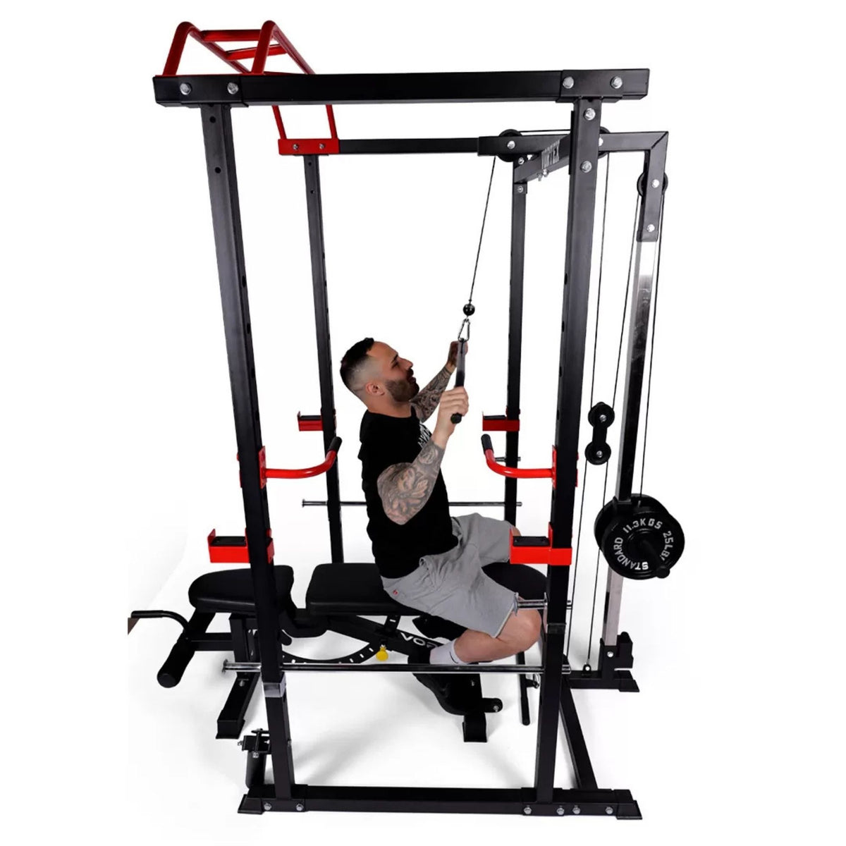 Vortex Olympic Squat Cage 1000 lb Weight Capacity Included with LAT Pulldown System RBVX10 Man performing lat pulldown on power rack with bench and full cable setup