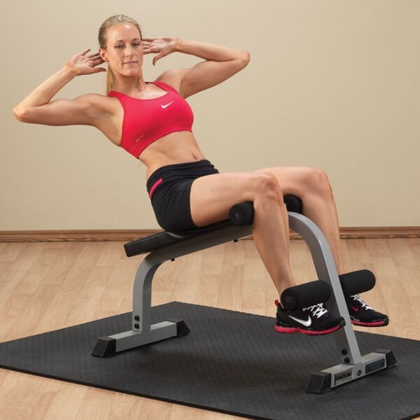 Body-Solid Powerline Ab Board PAB139X with Model at Gym