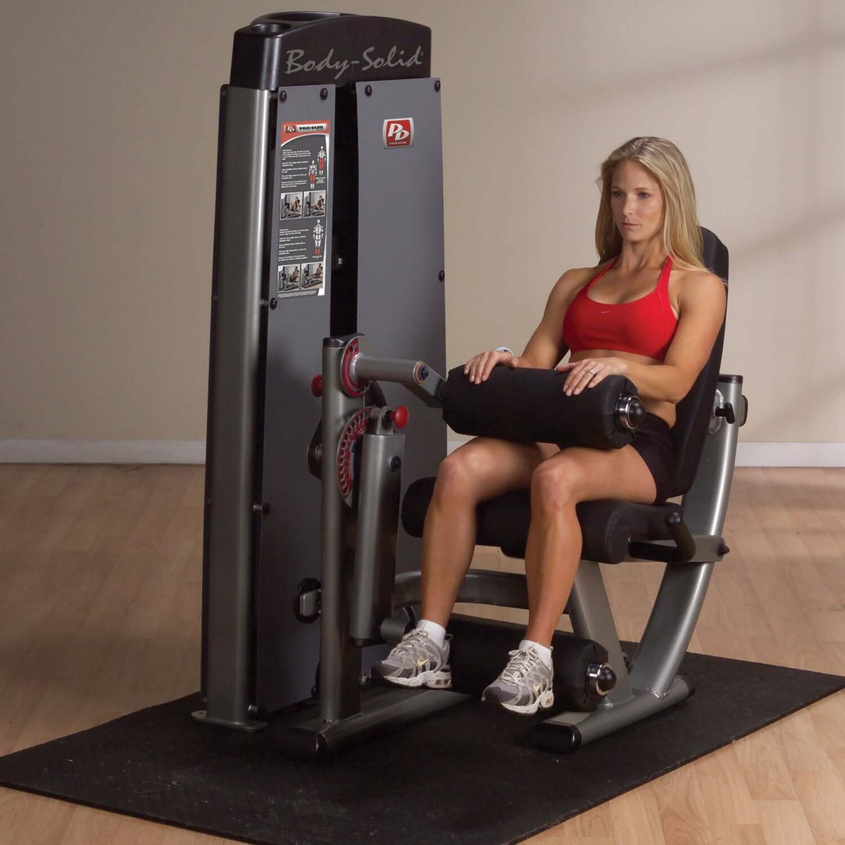 Body-Solid (DLEC-SF) Pro Dual Leg Extension & Curl Machine with fitness client