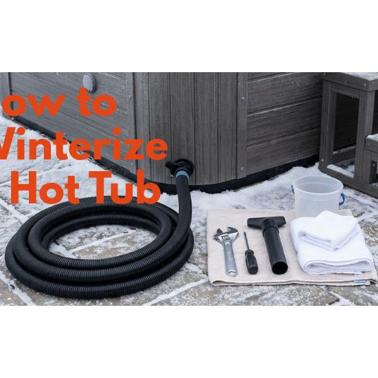 Hot tub winterization setup with drain hose and basic tools