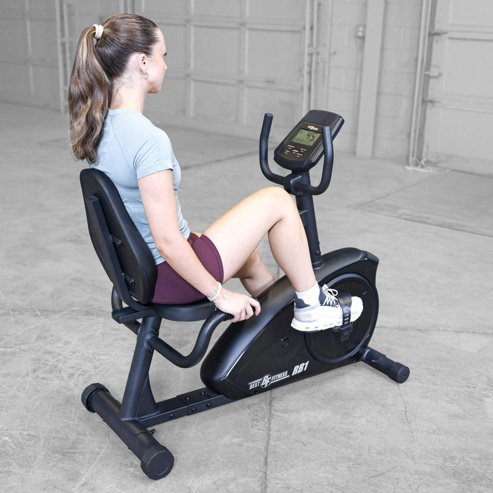Best Fitness Recumbent Bike BFRB1B Woman using Best Fitness RB1 recumbent exercise bike during a workout, pedaling with proper posture.