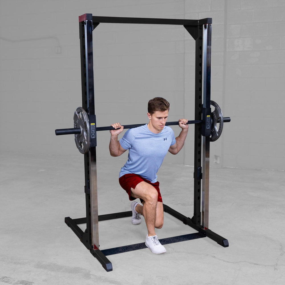 Best Fitness Smith Machine BFSM250B Man performing barbell lunge exercise using Body-Solid Smith machine for controlled movement.