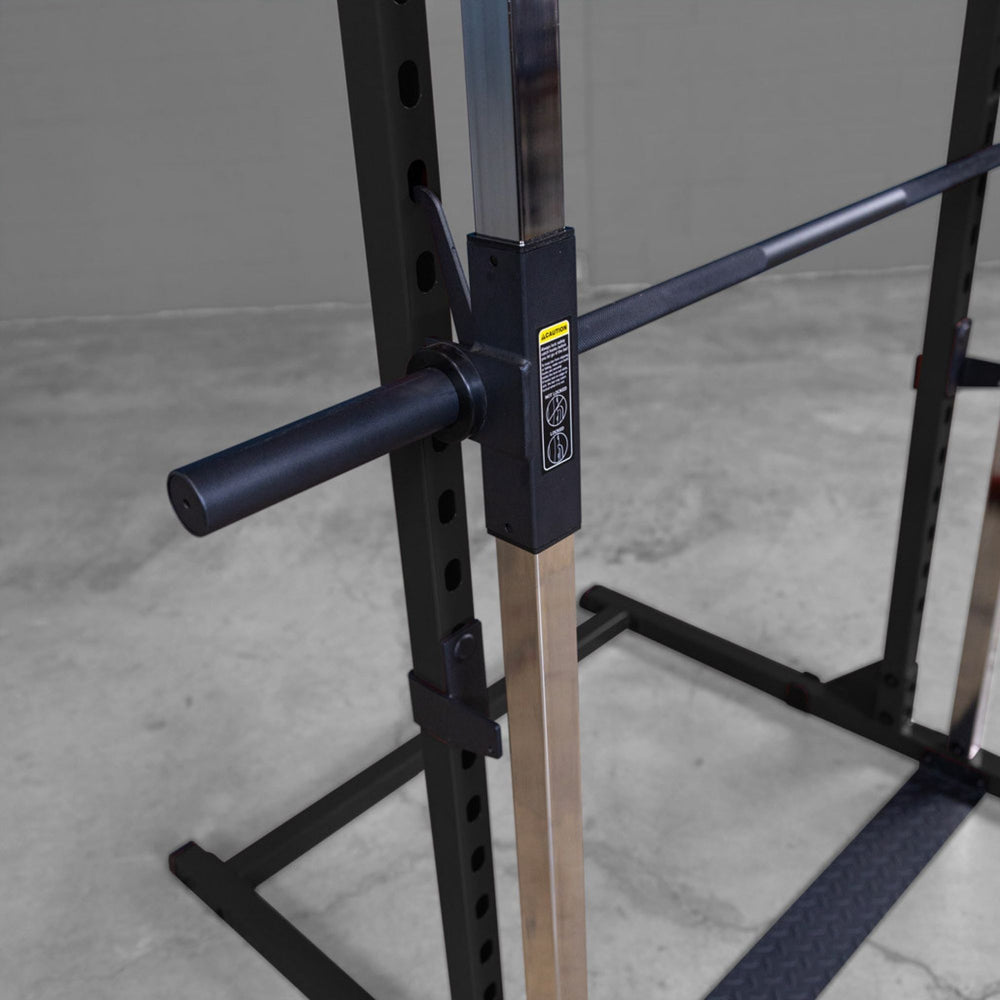 Best Fitness Smith Machine BFSM250B Side detail of smooth chrome guide rails and bar catch mechanism on Body-Solid Smith machine.