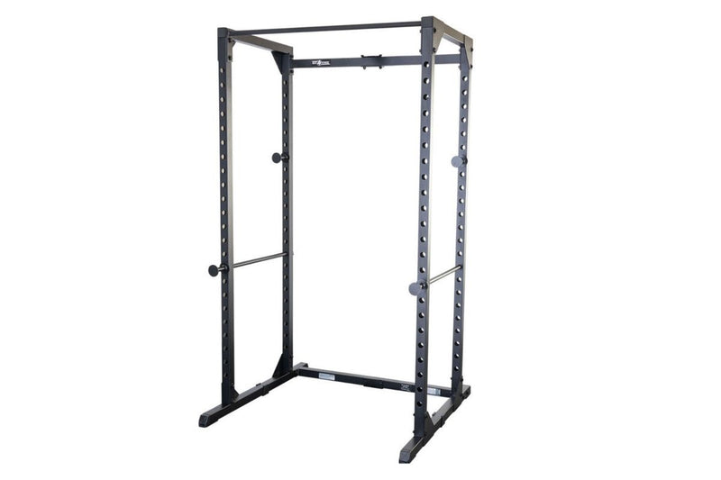 A black steel Body-Solid Best Fitness Power Rack Package BFPR100B power rack with safety bars and weight plates, shown on a plain white background.