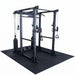 A black multi-functional home gym power rack with cable pulleys, weight plates, and a large black rubber mat base, shown on a solid white background.