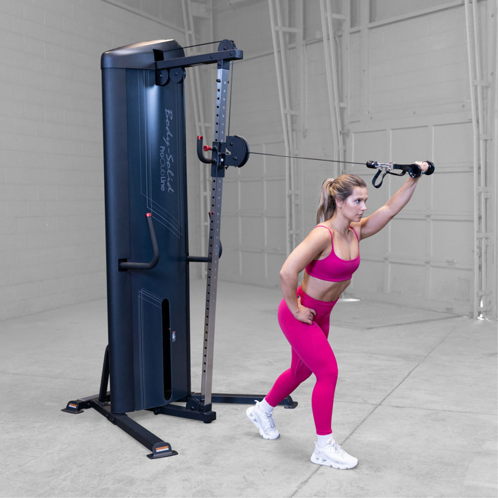 Body-Solid-S2CC-Series-2-Cable-Column-Single-Arm-Cable-Front-Punch. Woman exercising on a cable machine in a gym setting