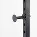 Body-Solid Best Fitness Power Rack BFPR100B Close-up view of power rack safety peg inserted into steel frame adjustment holes for barbell support.
