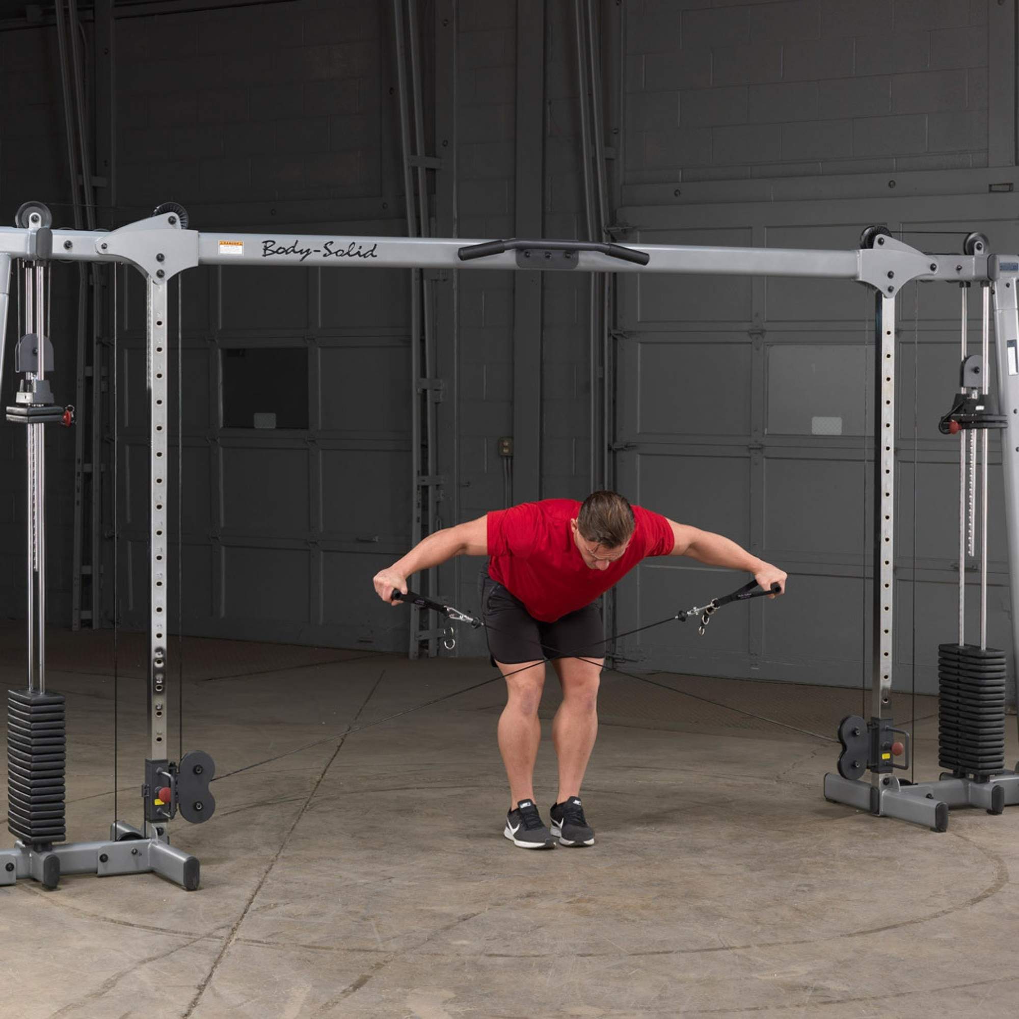 Body-Solid Cable Crossover GDCC250B used for bent-over rear delt fly cable exercise