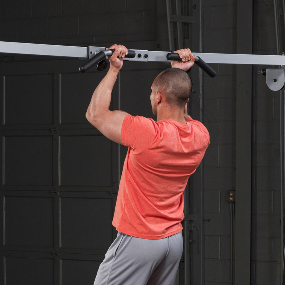 Body-Solid Cable Crossover Pull Up Attachment GCA2 performing pull up a man Back side view