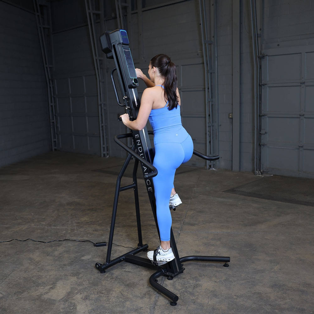 Body-Solid Climber Endurance CL300 Back view of woman adjusting settings 