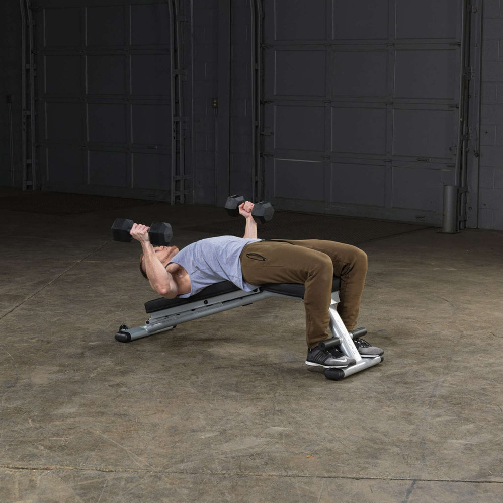 Body-Solid Commercial Folding Bench GFID225B Man performing decline dumbbell bench press on fitness bench