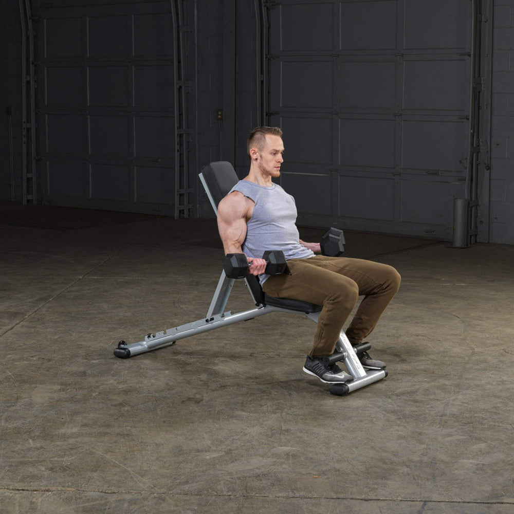 Body-Solid Commercial Folding Bench GFID225B Man performing seated dumbbell curls on adjustable incline bench