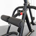 Body-Solid Corner Leverage Gym GLGS100B Close-up of lower frame showing dual padded leg rollers and red adjustment knob on Body-Solid workout machine.
