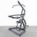 Body-Solid Corner Leverage Gym GLGS100B Front-angled view of Body-Solid multi-function training station displaying press arms, pulleys, and support base.
