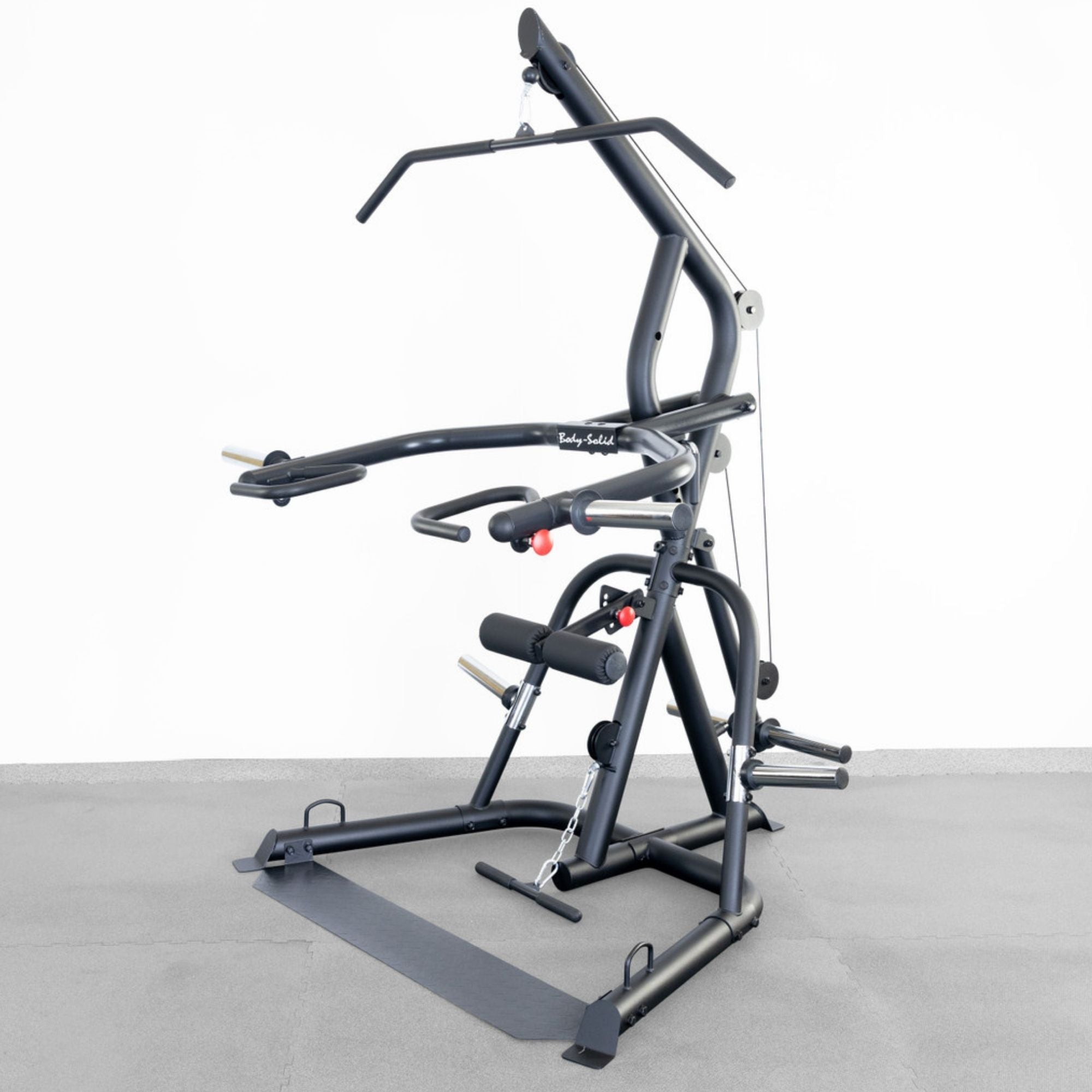 Body-Solid Corner Leverage Gym GLGS100B Full view of Body-Solid multi-function gym station featuring pulleys, press arms, padded rollers, and a lat bar on a gray floor background.
