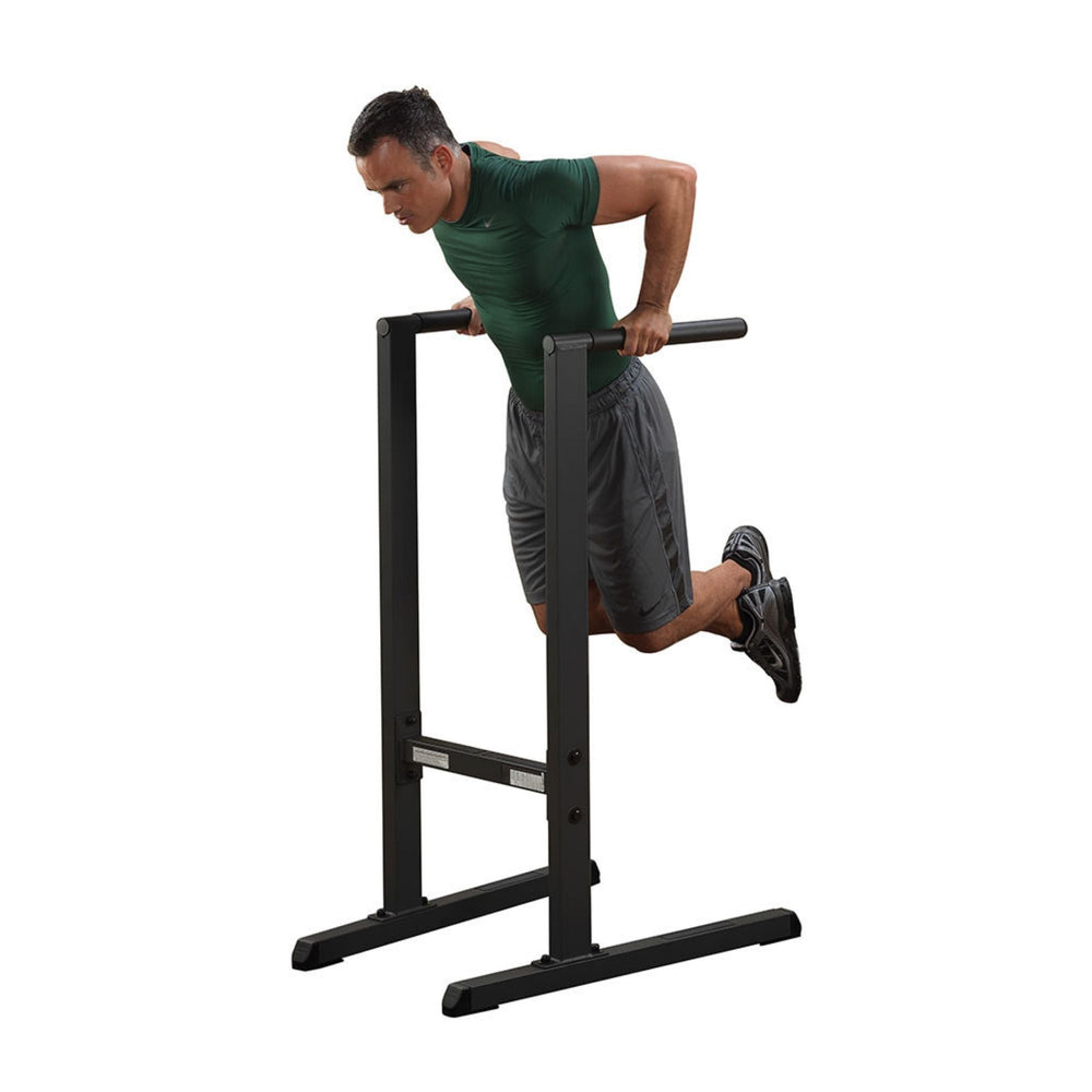 Body-Solid Dip Station GDIP59B Man performing bodyweight dips  station with a neutral grip