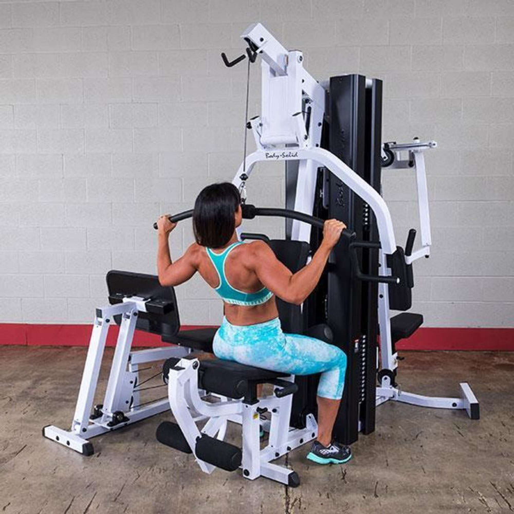 Body-Solid Dual Stack Home Gym with Leg Press EXM3000LPS Standing Military Press Women