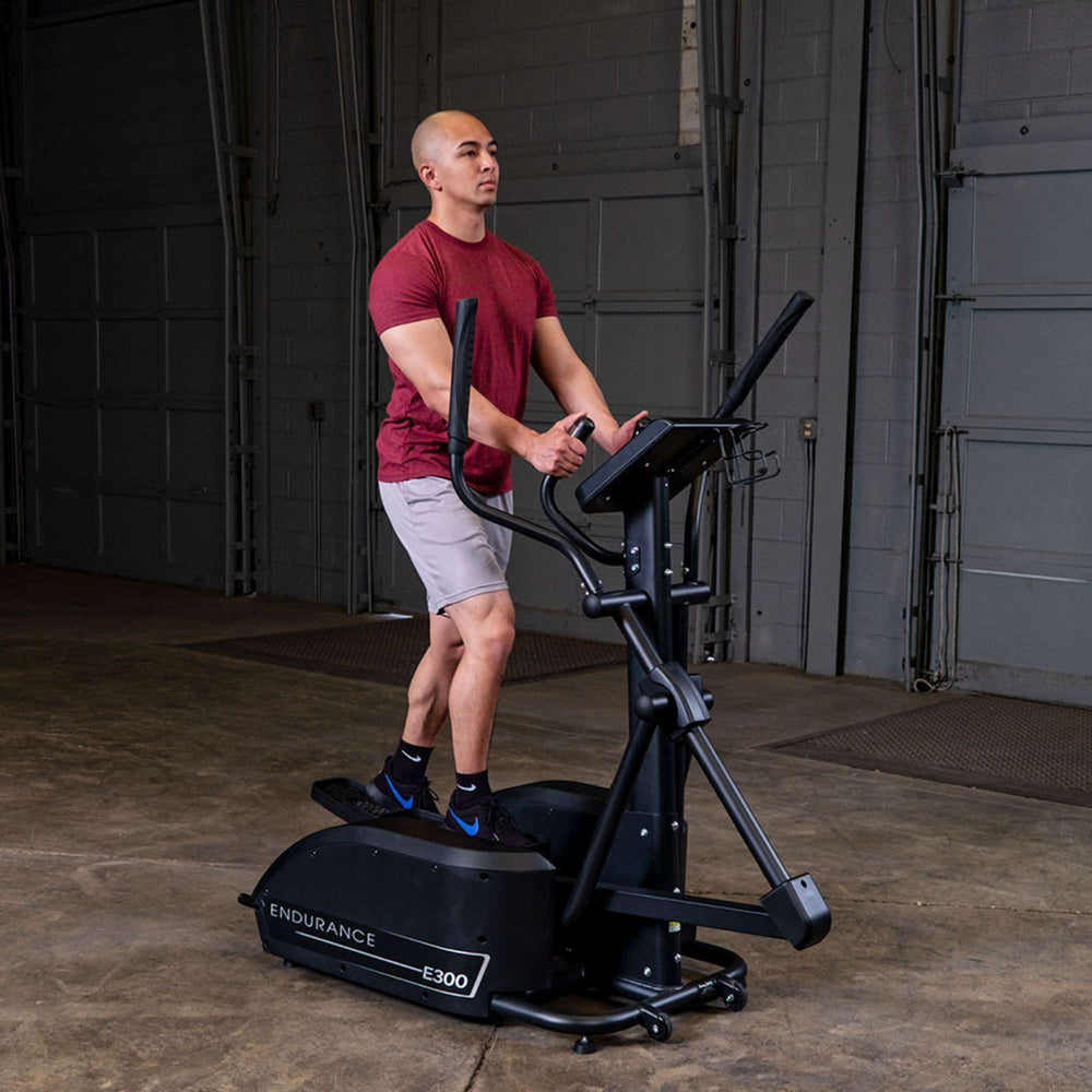  Body-Solid Endurance E300 Center Drive Elliptical Trainer man exercising 