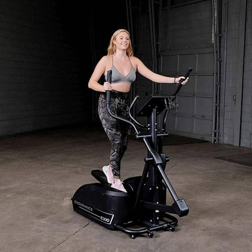  Body-Solid Endurance E300 Center Drive Elliptical Trainer woman exercising 