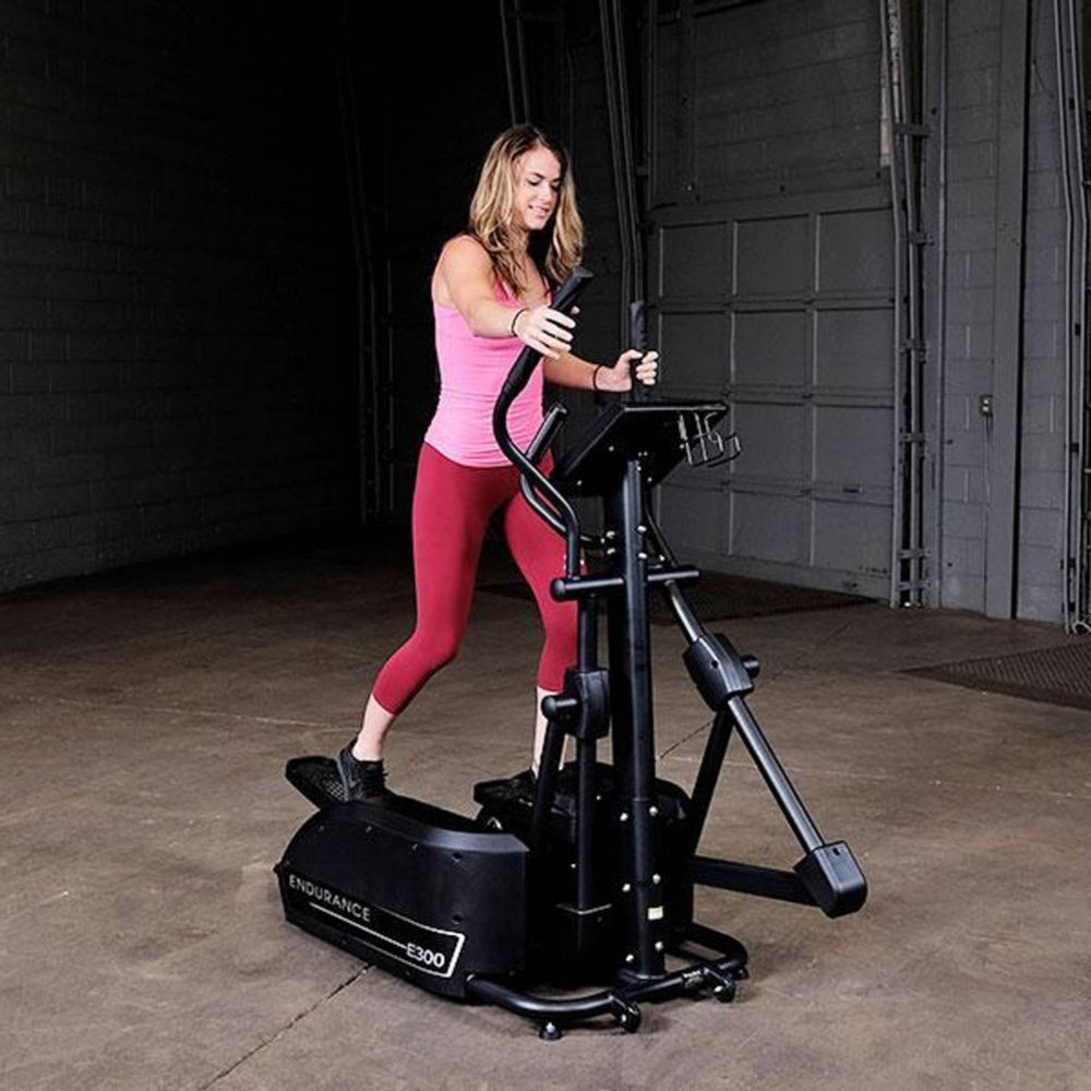  Body-Solid Endurance E300 Center Drive Elliptical Trainer woman exercising home or commercial gyms
