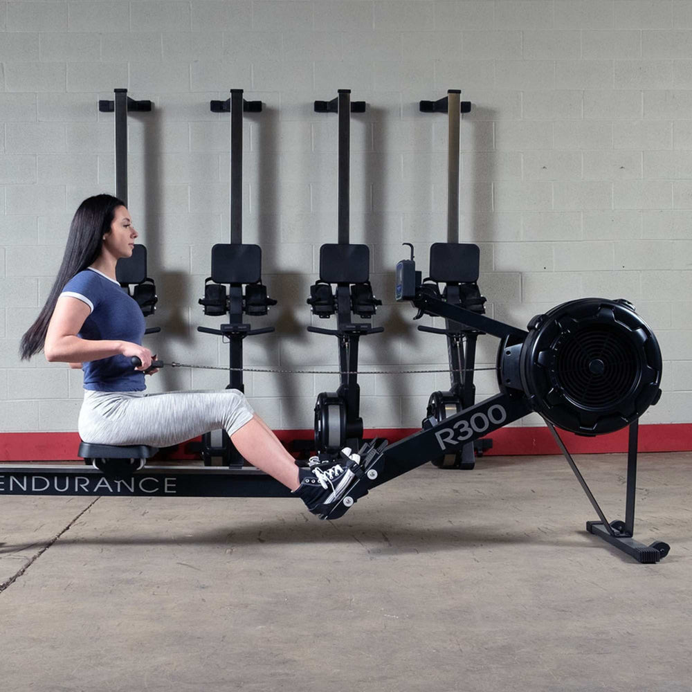 Body-Solid Endurance Indoor Rower R300 user performing side view
