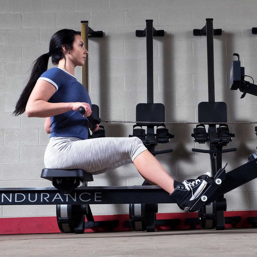 Body-Solid Endurance Indoor Rower R300 user performing side view close up 