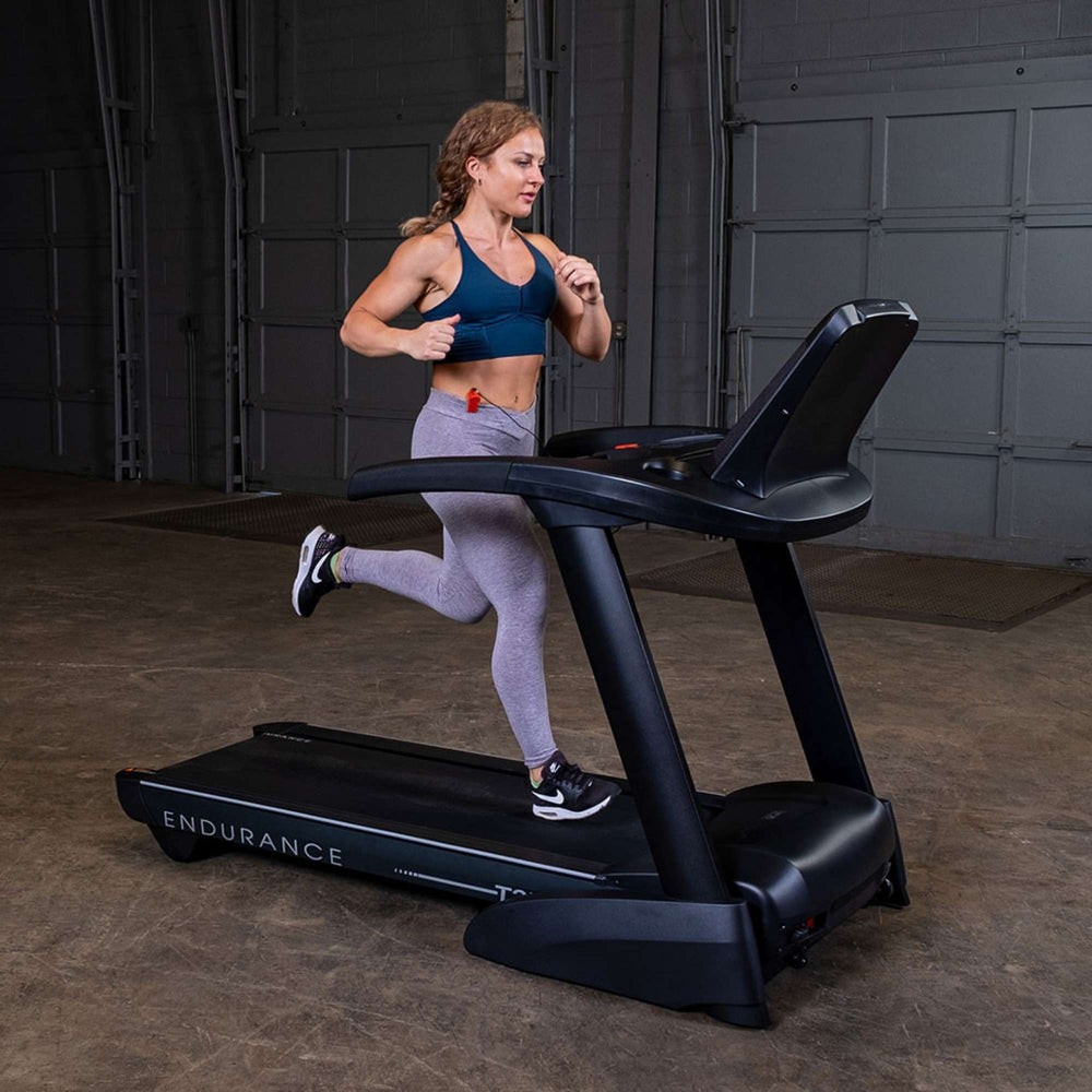 Body-Solid Endurance T25 Folding Treadmill T25 A woman using 