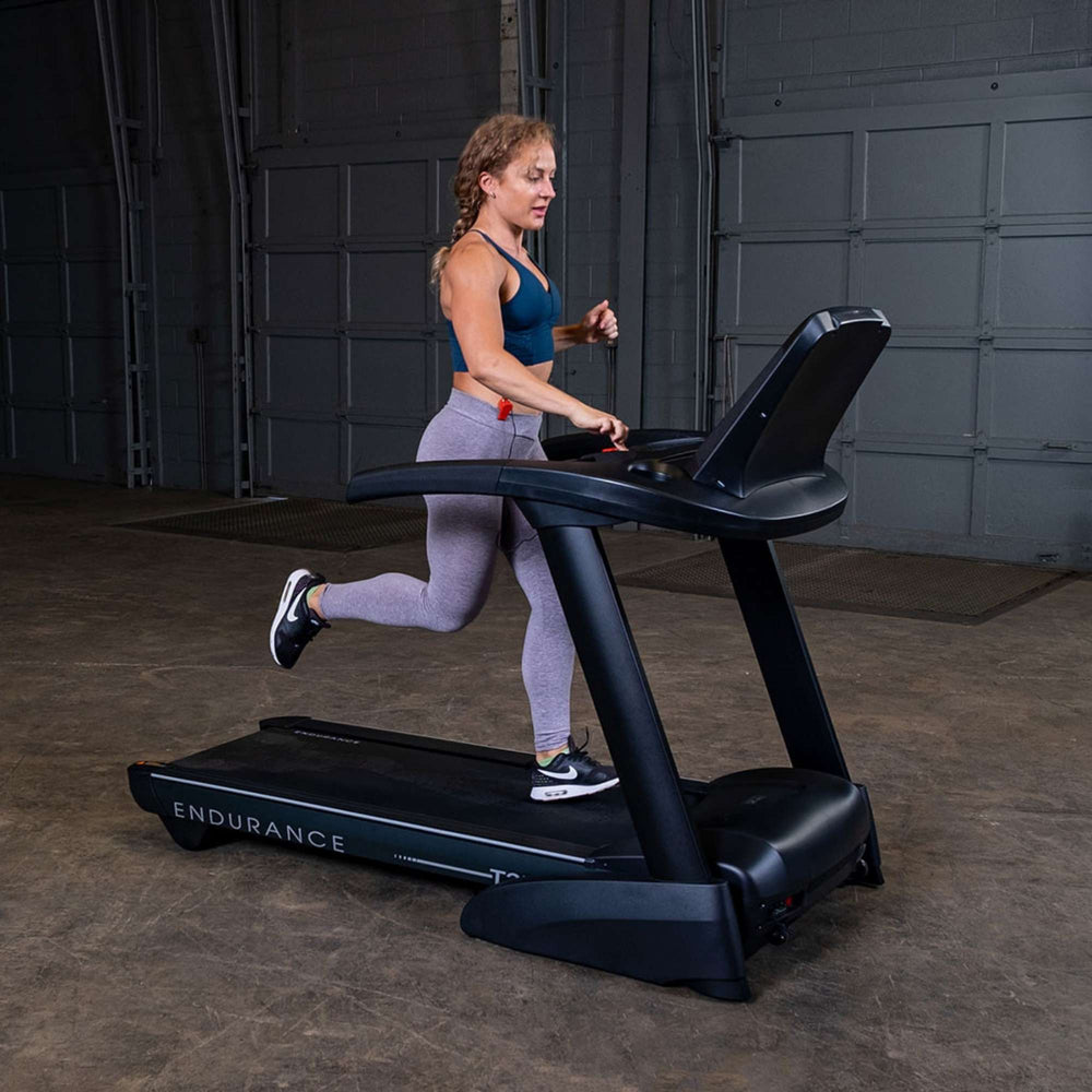 Body-Solid Endurance T25 Folding Treadmill T25 a woman exercising 
