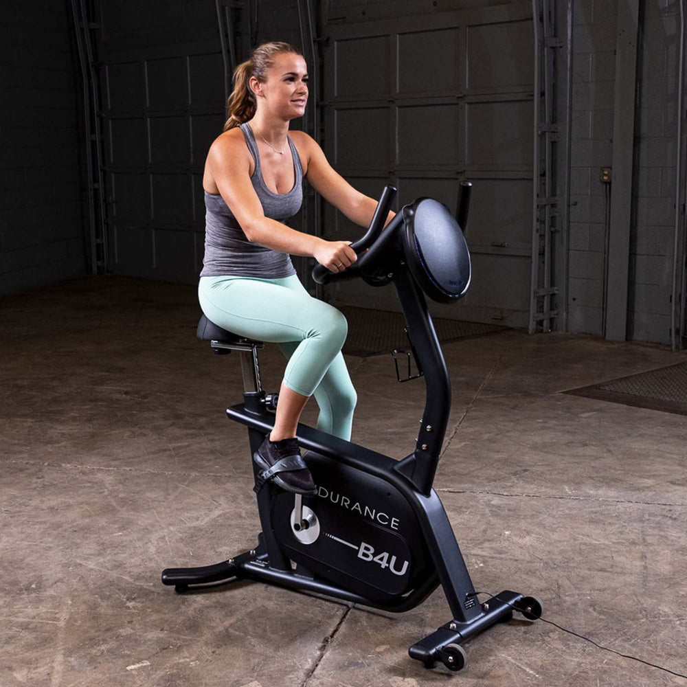 Body-Solid Endurance Upright Bike B4UB a person performing close Side View