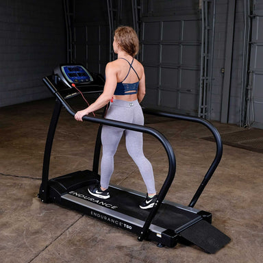 Body-Solid Endurance Walking Treadmill T50 Woman walking on Endurance T50 treadmill in home gym setting