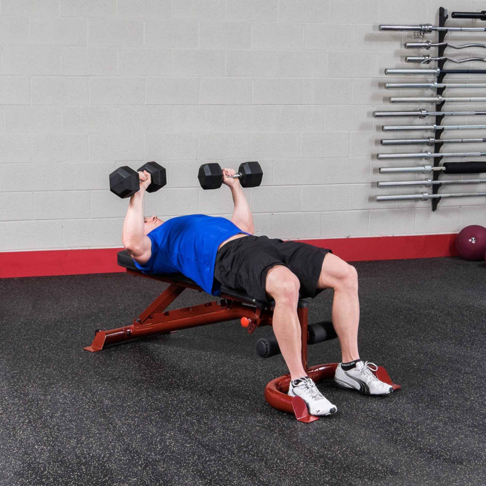 Body-Solid Flat Incline Decline Bench GFID100B Man performing dumbbell chest press on a decline bench