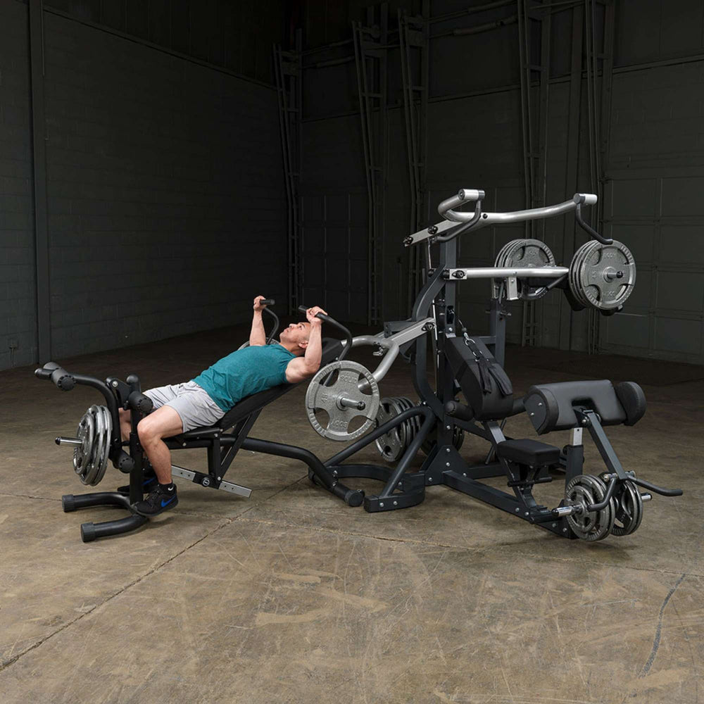 Body-Solid Free Weight Leverage Gym SBL460P4 Man doing a chest press