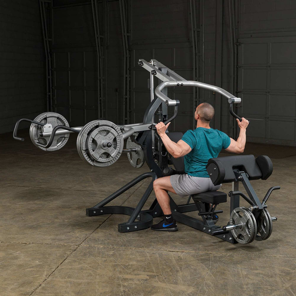 Body-Solid Free Weight Leverage Gym SBL460P4 man doing a shoulder press