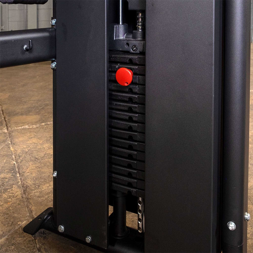 Body-Solid Functional Trainer Shrouds GFT100SH Close-up of the weight stack on a functional trainer machine featuring a red selector pin and black steel plates