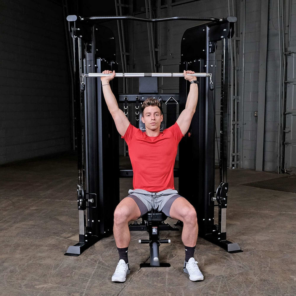 Body-Solid GFT100 Functional Trainer GFT100 perform a lat pulldown exercise
