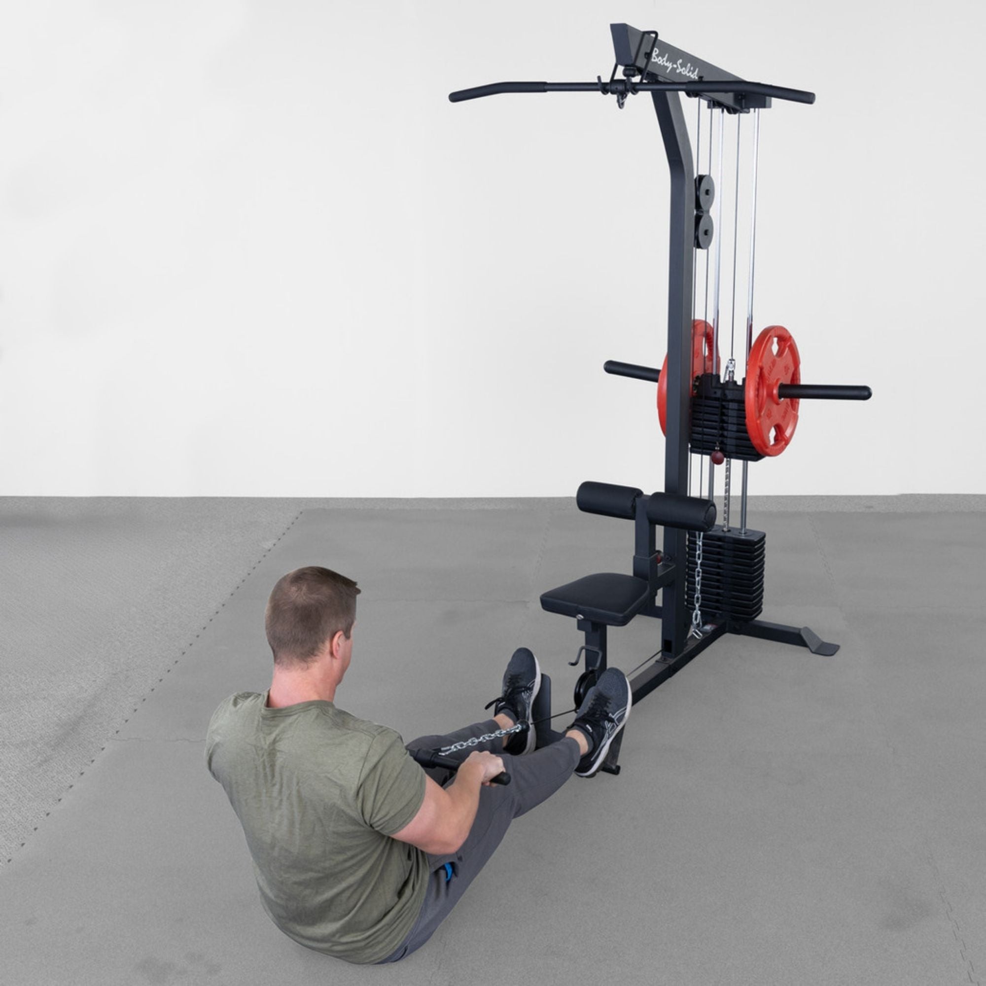 Body-Solid Lat Machine With Weight Stack GLM85B Man doing seated low rows 