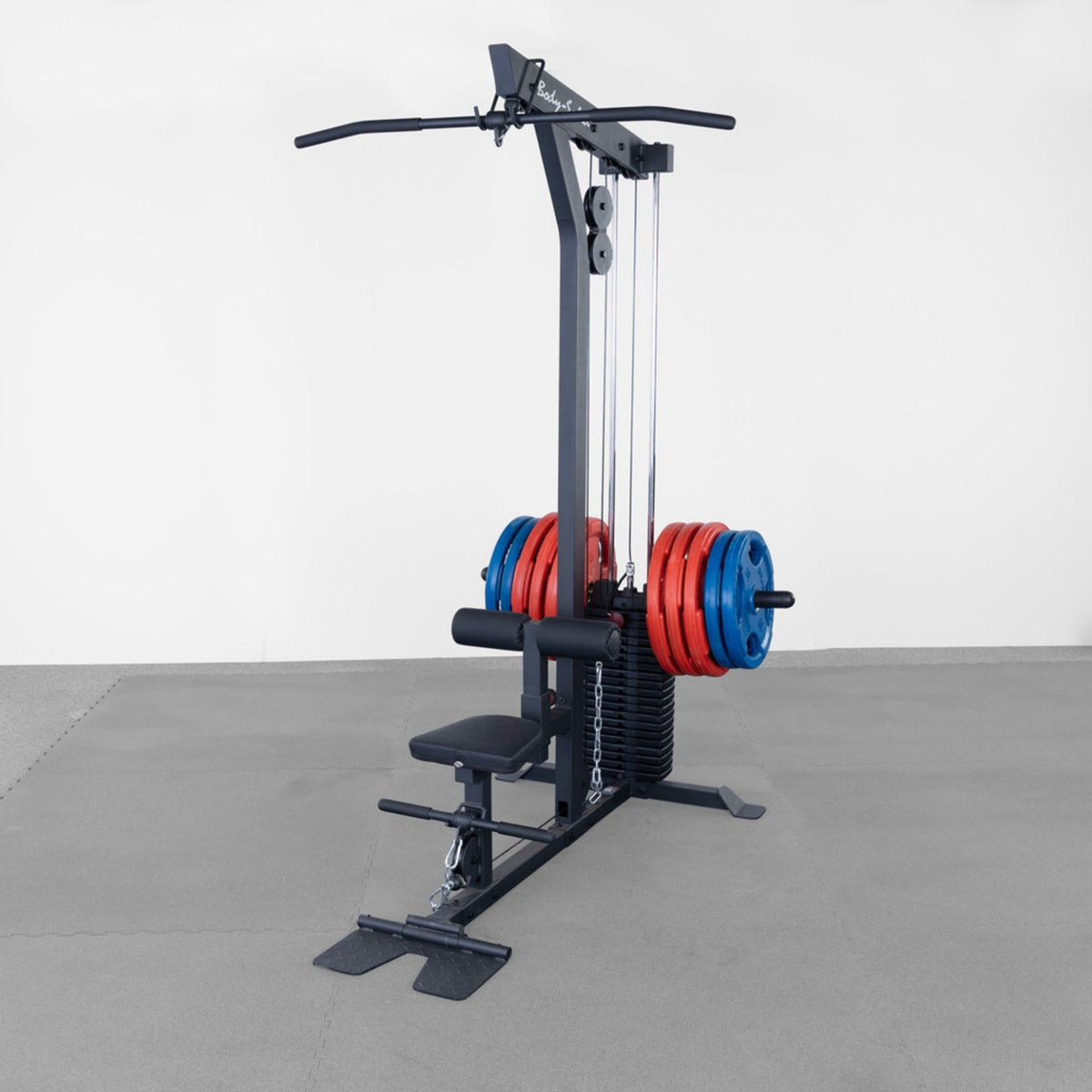 Body-Solid Lat Machine With Weight Stack GLM85B with red and blue bumper plates