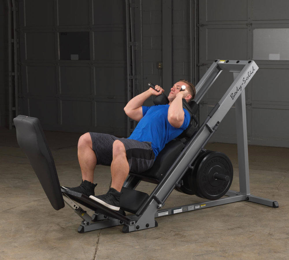 GLPH1100B Leg Press Hack Squat - man doing a hack squat exercise