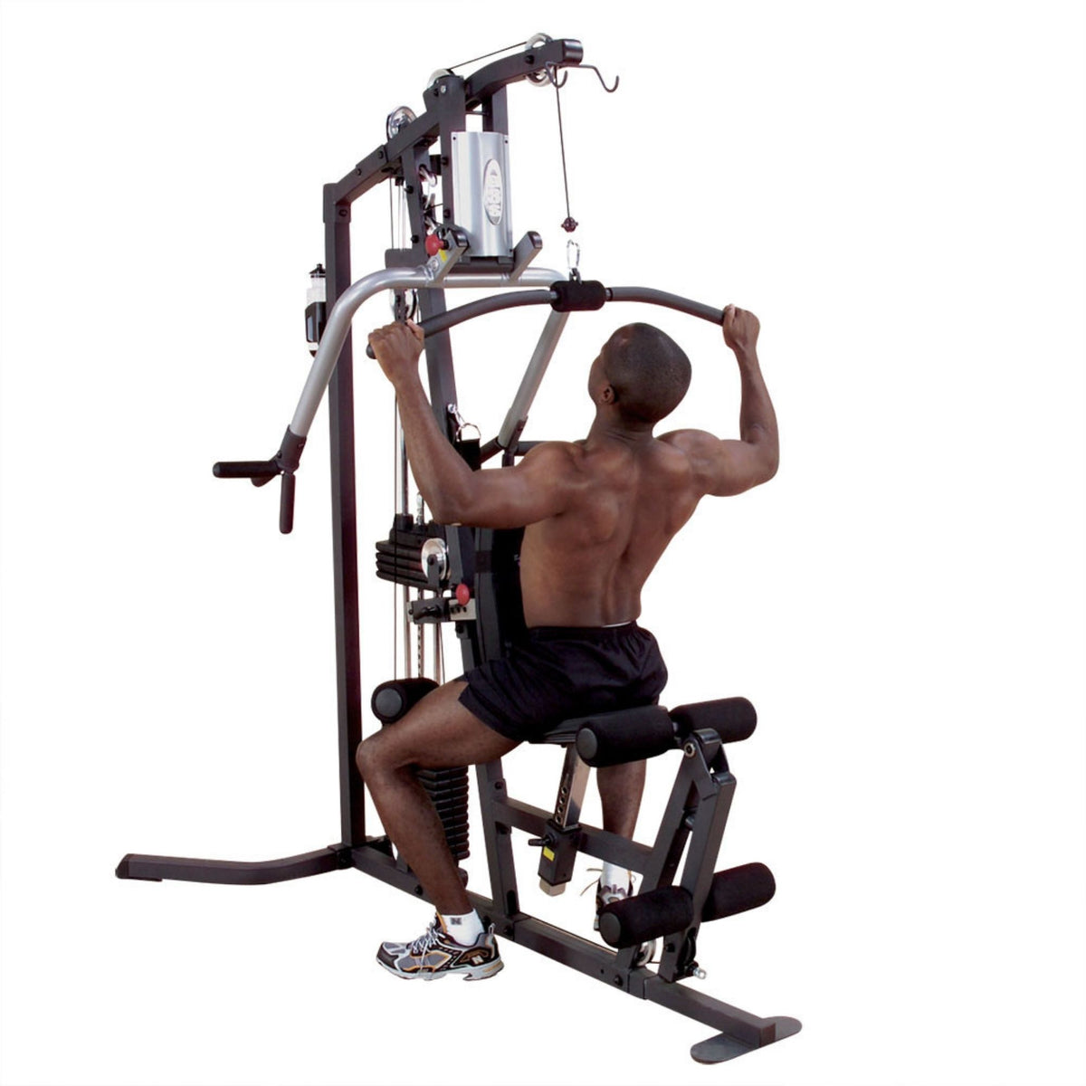 Body-Solid Multi-Station Gym perform a lat pulldown exercise 