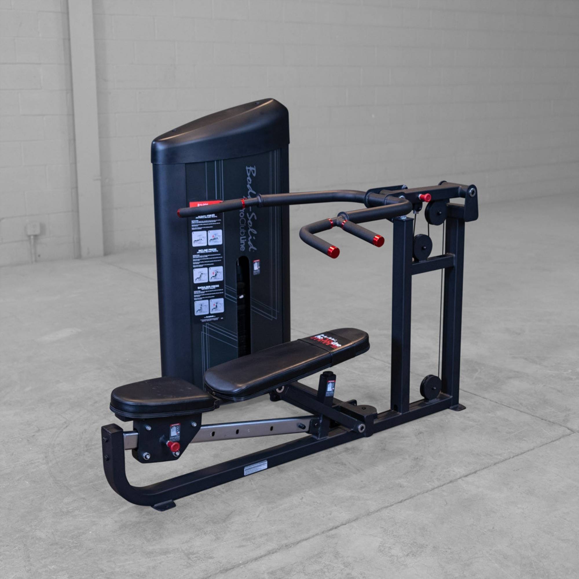 Body-Solid PCL2 Multi Press S2MPX Empty shoulder press and chest press combo machine in an industrial-style gym