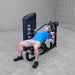 Body-Solid PCL2 Multi Press S2MPX Man using the machine for an incline chest press exercise with elbows bent