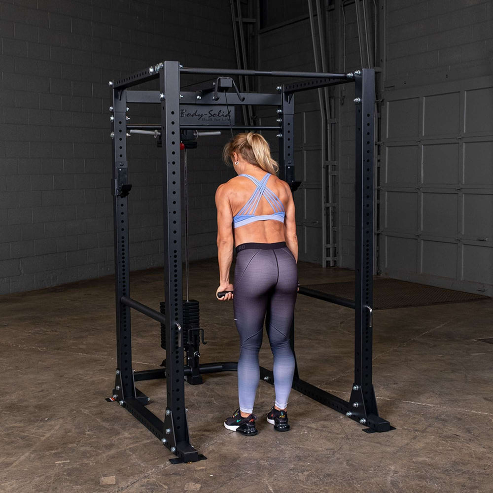 Body-Solid Power Rack Lat Attachment GLA400  a person using a lat attachment standing